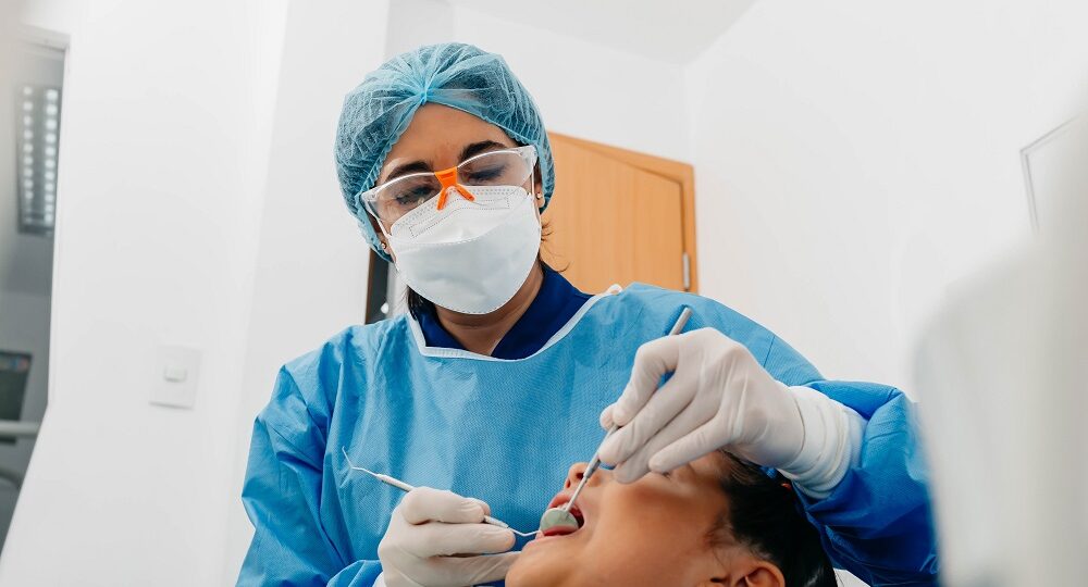 Female dental specialist treating a patient in a modern dental clinic, illustrating professional orthodontic care in Marietta.