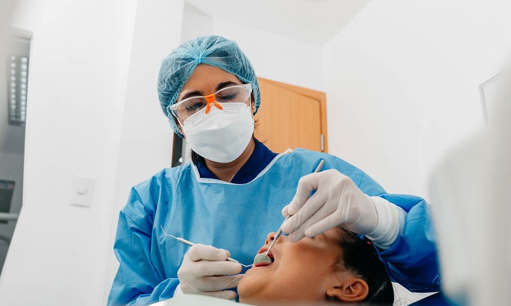 Female dental specialist treating a patient in a modern dental clinic, illustrating professional orthodontic care in Marietta.
